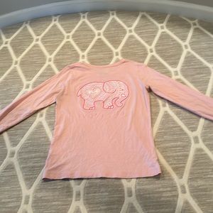 A pink shirt with an elephant on it